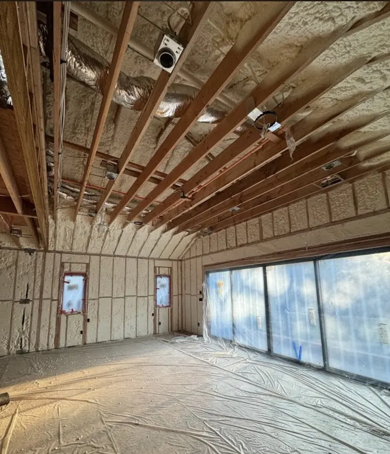 Interior walls and ceiling insulated with spray foam during new construction in Forsyth